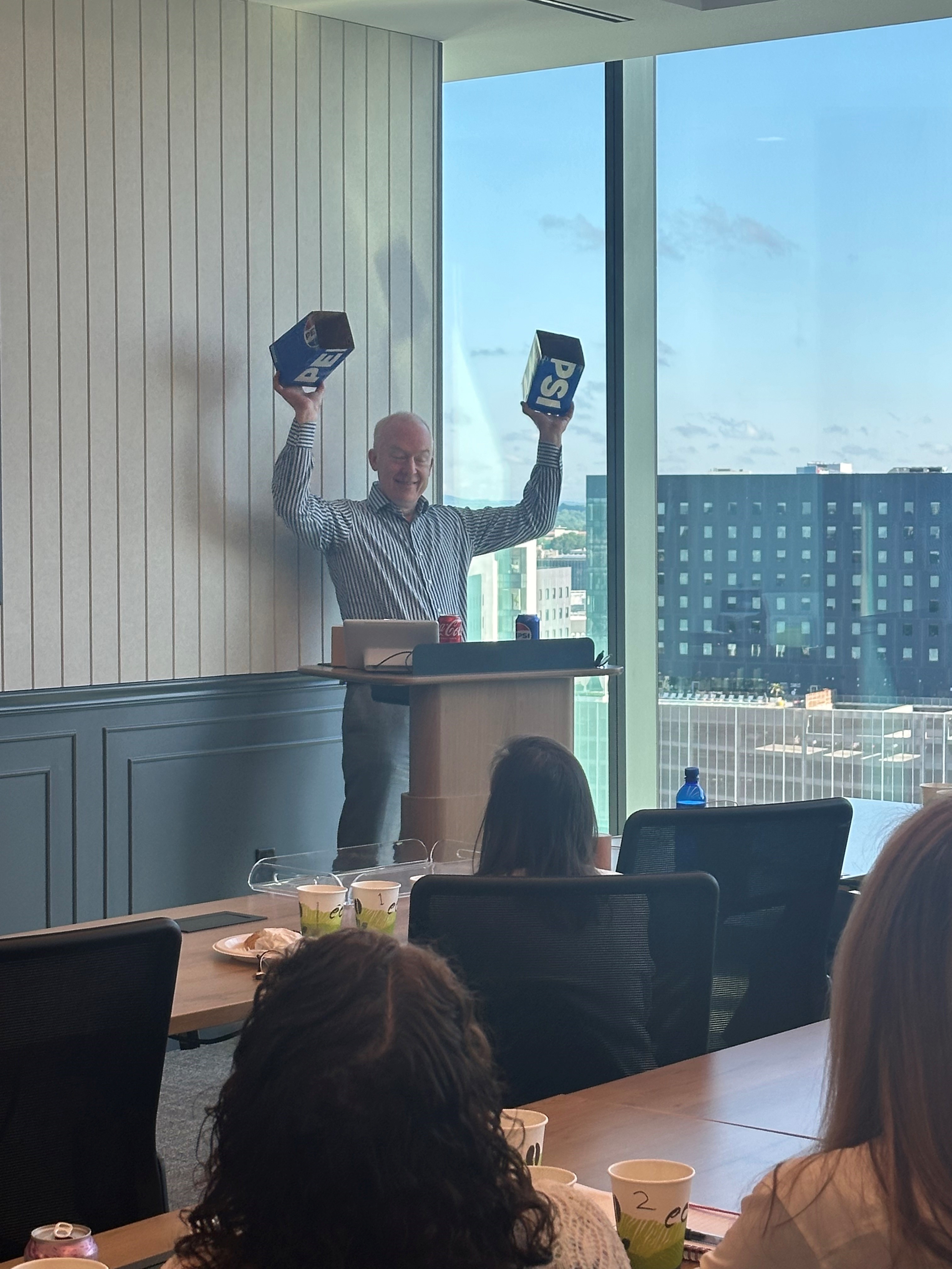 James Love presents in front of Womble's IP team.