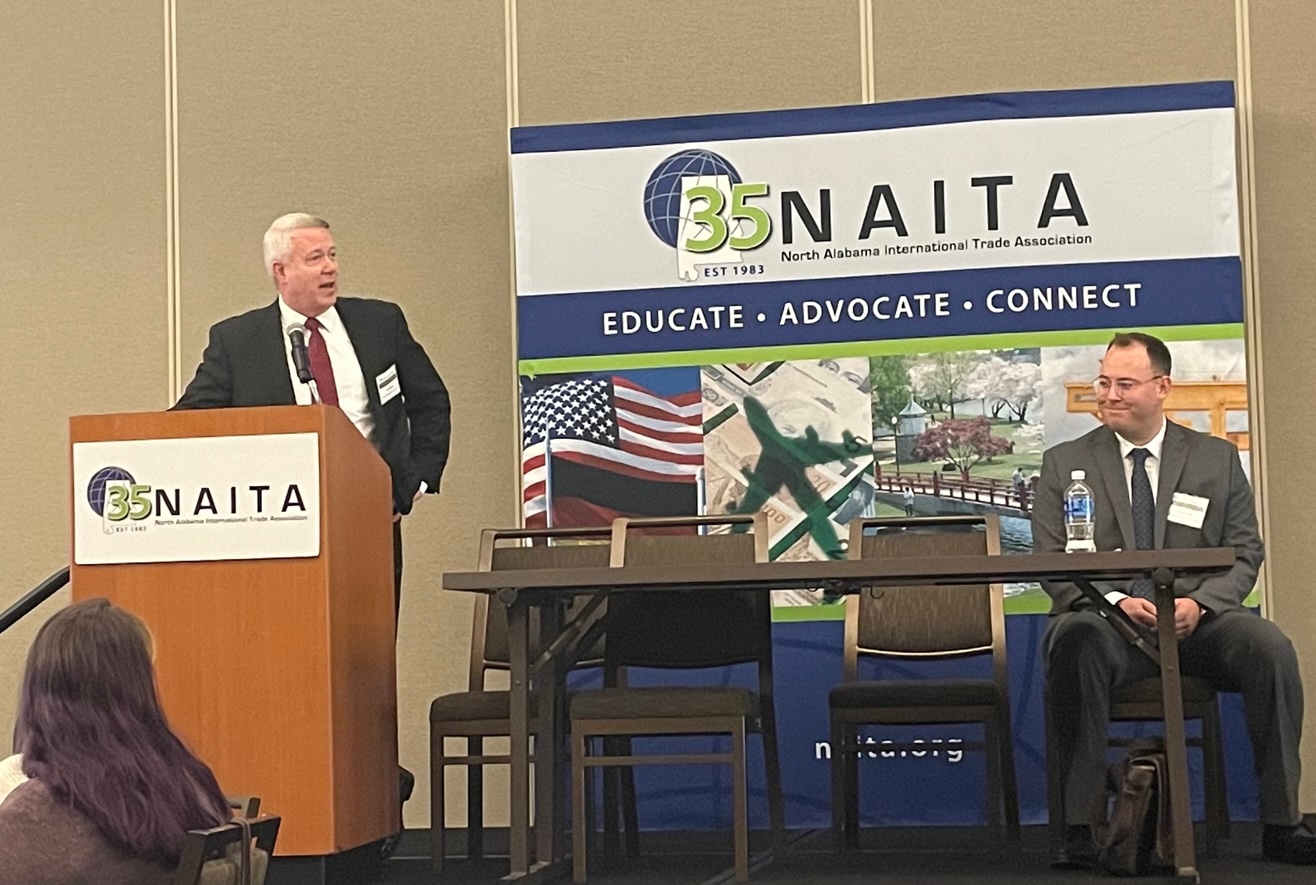 Alan Enslen and Julius Bodie on stage at the NAITA Global Strategies Forum.