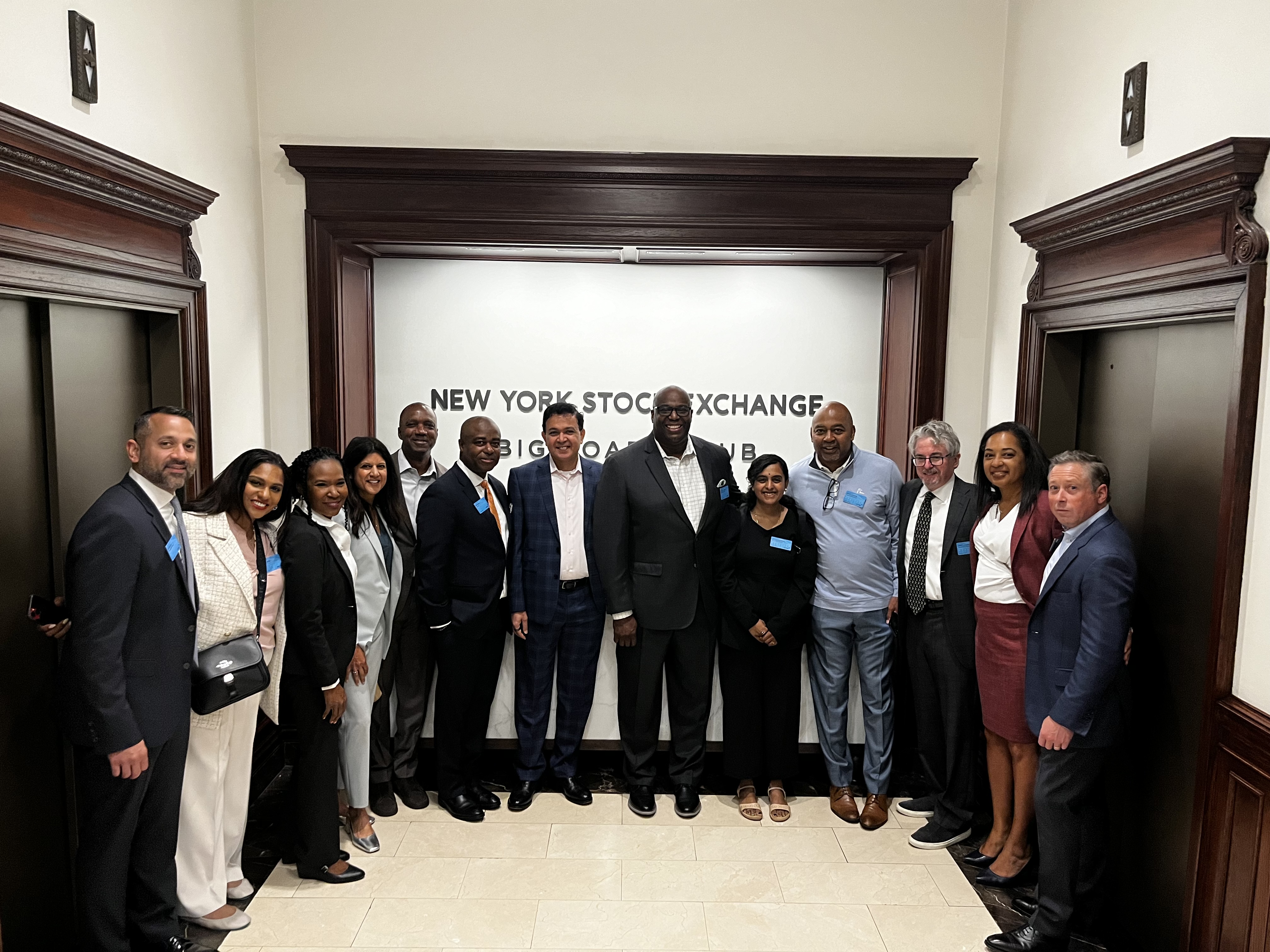 The NxGen COACH Network and Womble Bond Dickinson teams at the New York Stock Exchange.