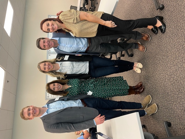 Womble Bond Dickinson's Dave Efird, Betty Temple, and Emily Gallagher stand with Honeywell's David Cohen and the NC Bar Foundation's Bianca Simmons.