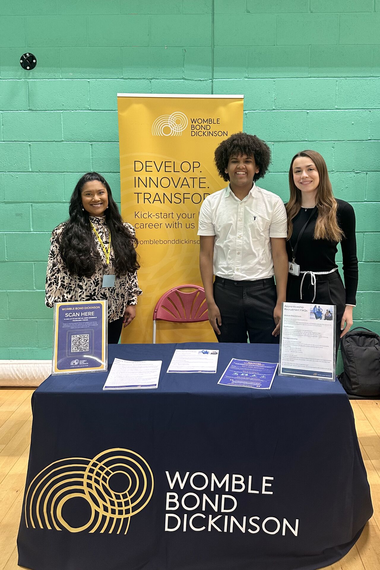 Three people at WBD event stand