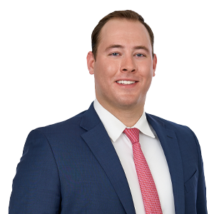 Man in a blue business suit and reddish tie