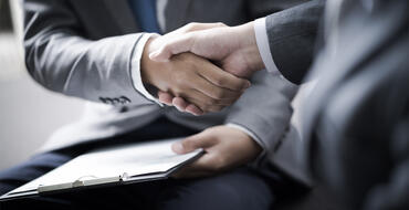 Business handshake - Shutterstock 594729779