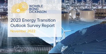 The highlighted text reads, "Womble Bond Dickinson 2023 Energy Transition Outlook Survey Report - November 2022." The background displays a variety of energy sources, signifying the transition from more traditional sources like oil and gas to "greener" sources such as hydrogen and solar.