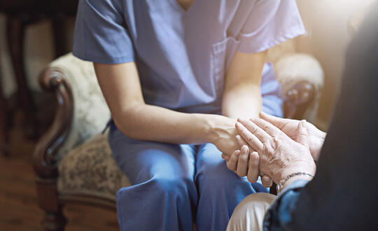 Long-Term Care Provider Assisting a Resident