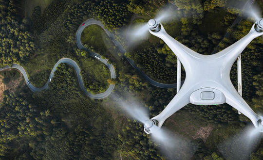 Drone Against Green Landscape - Shutterstock 683495518