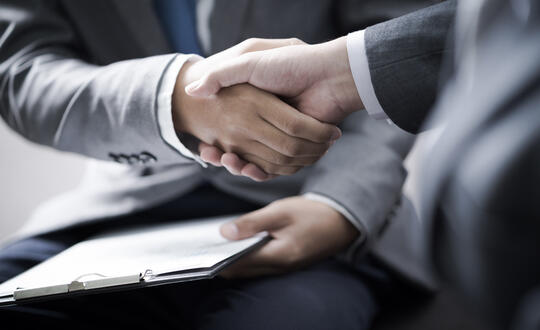 Business handshake - Shutterstock 594729779