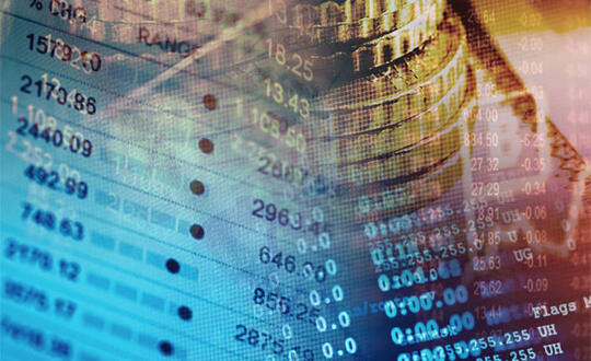 Financial charts and coins - Photo from Shutterstock (485866294)