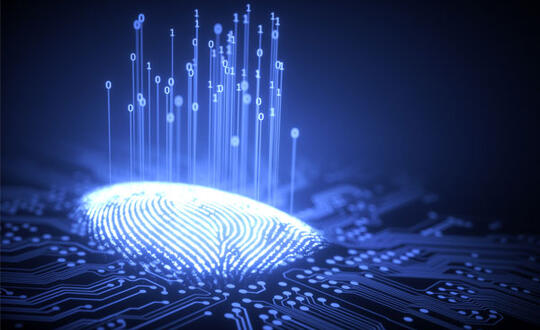 A thumbprint lights up on top of a print-reading surface, as data is gathered and symbolized by ones and zeros lifting up from the thumbprint.