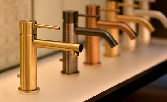 A line of faucets on display.