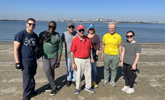 A Womble team serves during a beach clean-up project around Thompson Island.