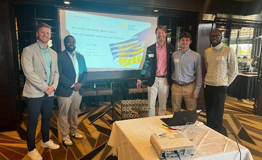 A team from Womble Bond Dickinson's Baltimore office with Keith Hinder at his ACC Baltimore presentation.