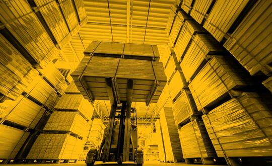 Picture of forklift lifting box in warehouse