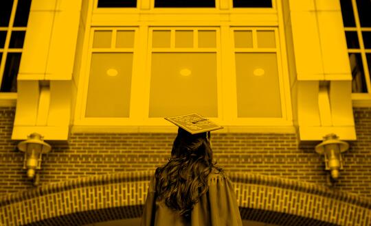 Picture of graduate under big building