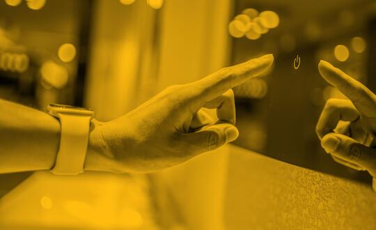 Picture of someone pressing touch screen display