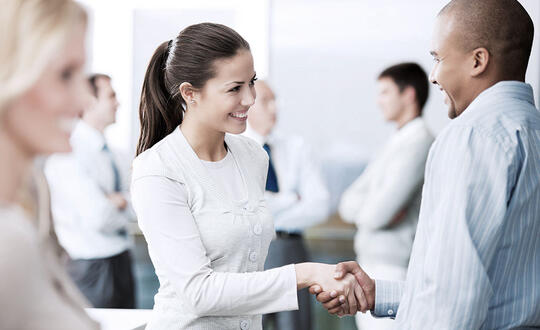 Man and woman shaking hands