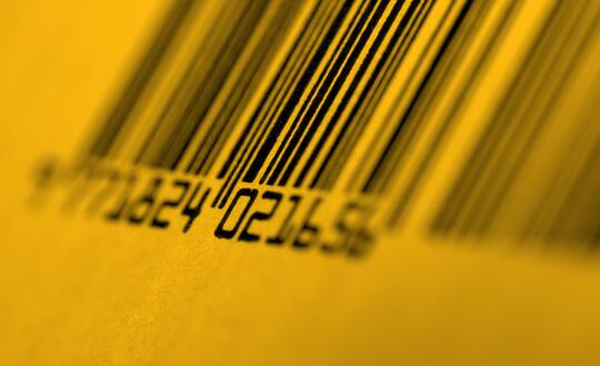 Close up of barcode. Image is edited with a yellow wash.