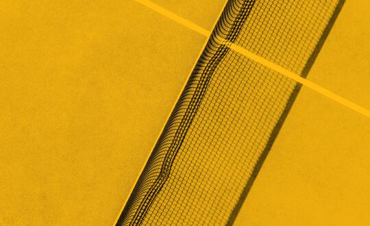 Bird's eye view of tennis court in yellow wash