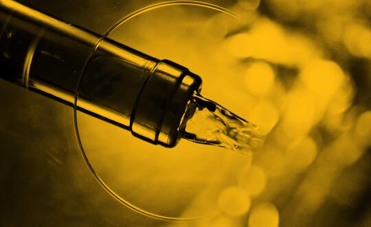 Close up shot of wine pouring into glass