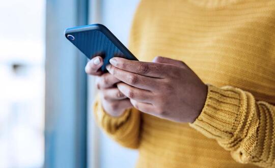Woman using mobile phone. 